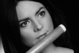 Dark Haired female flautist